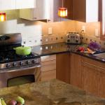 The kitchen back splash has evolved over the years. From a simple 4" riser to stop water to an elegant and functional aspect incorporated  into the entire design of the kitchen. 