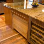 Center islands can be a striking focal point for your kitchen remodel. It can be a place to introduce a splash of color, additional textures, or even a distinctive shape. It can also add many elements of practicality, including additional storage, seating and of course additional counter space.